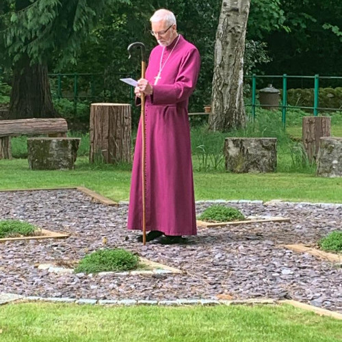 Praying for the garden during his visit